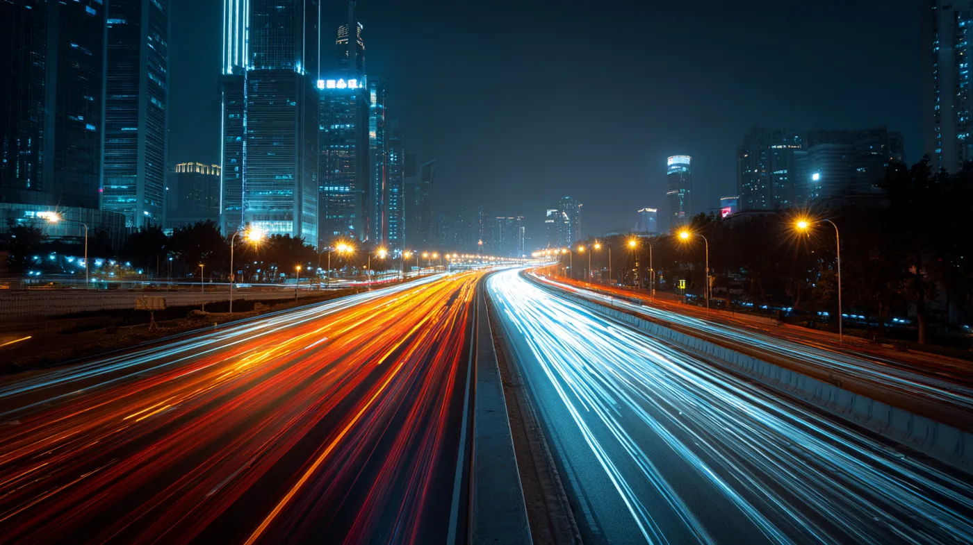 4K, long-exposure light trails on a highway at night, city skyline1.png
